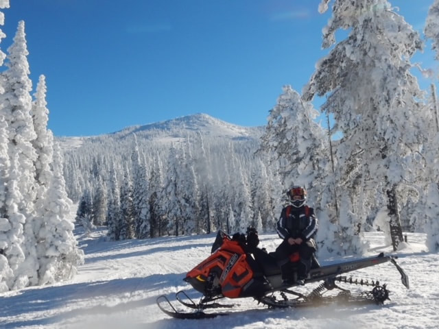 Our treasurer, Lee Benner in West Yellowstone on her sled.